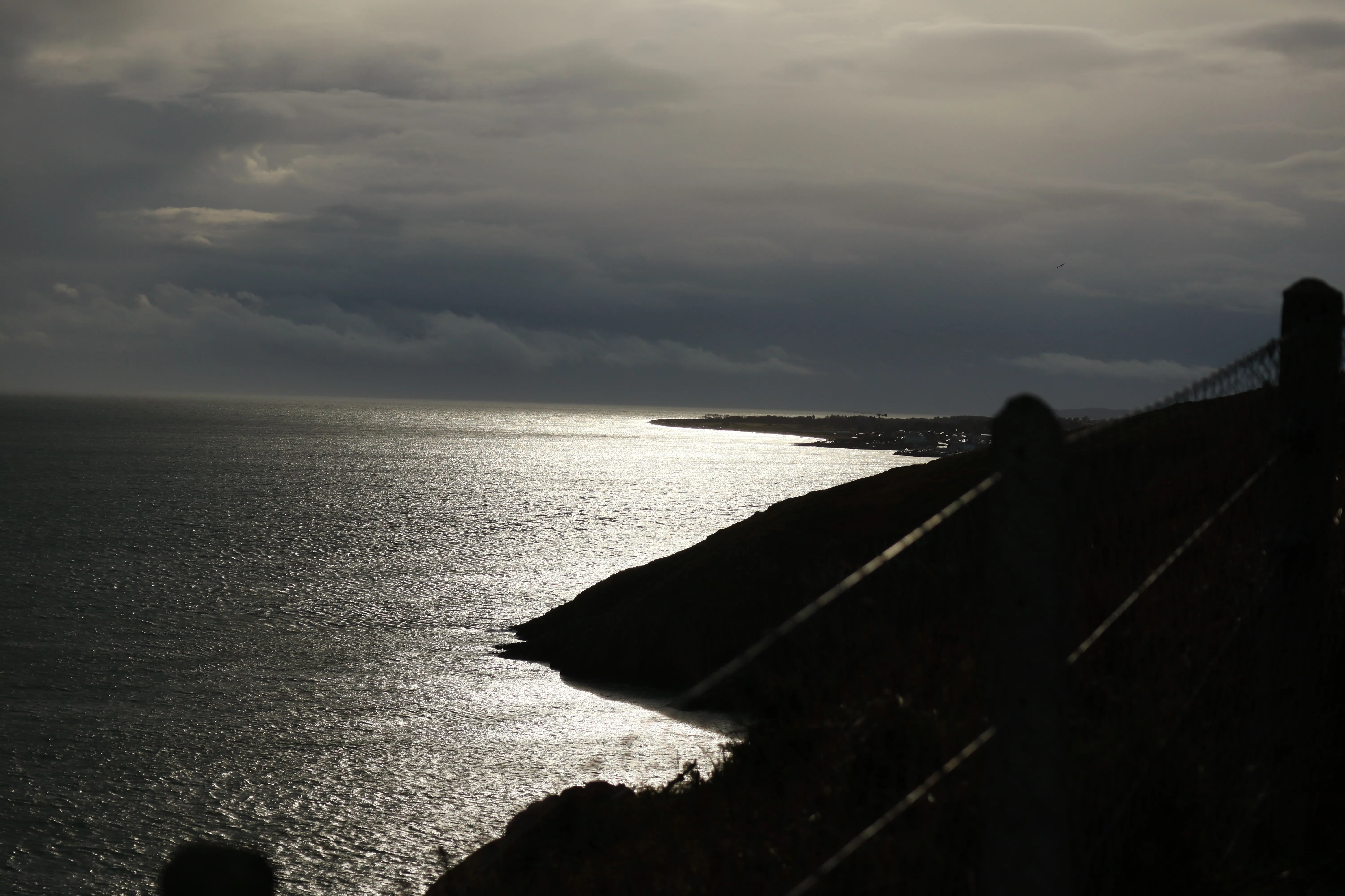 Coastal cliff with stormy sky